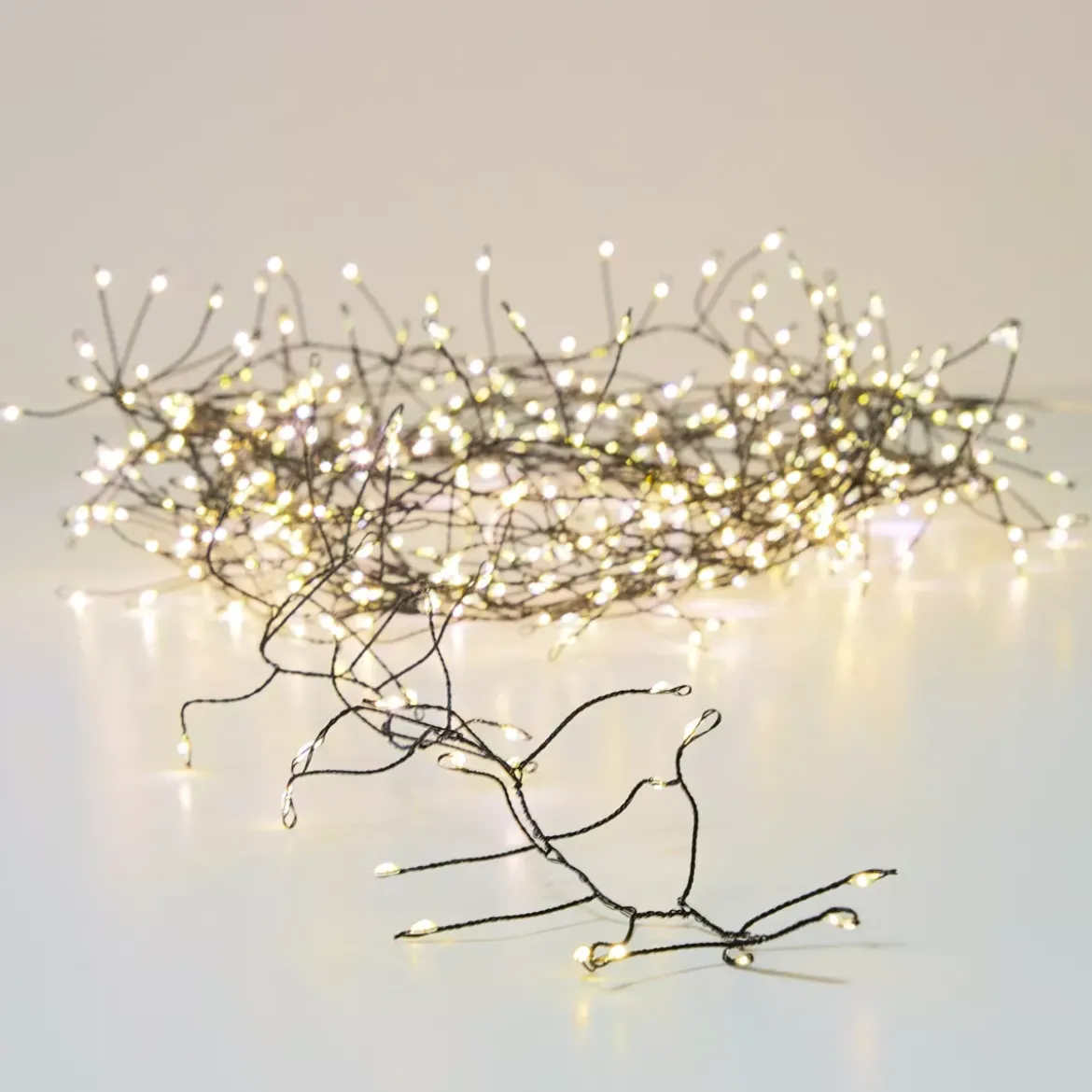 Ghirlanda luminosa 18 m 1440 Micro LED cavo nero Luxe Bianco caldo