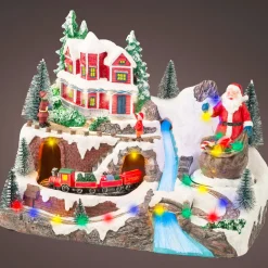 Villaggio di Natale luminoso e musicale Babbo Natale in montagna